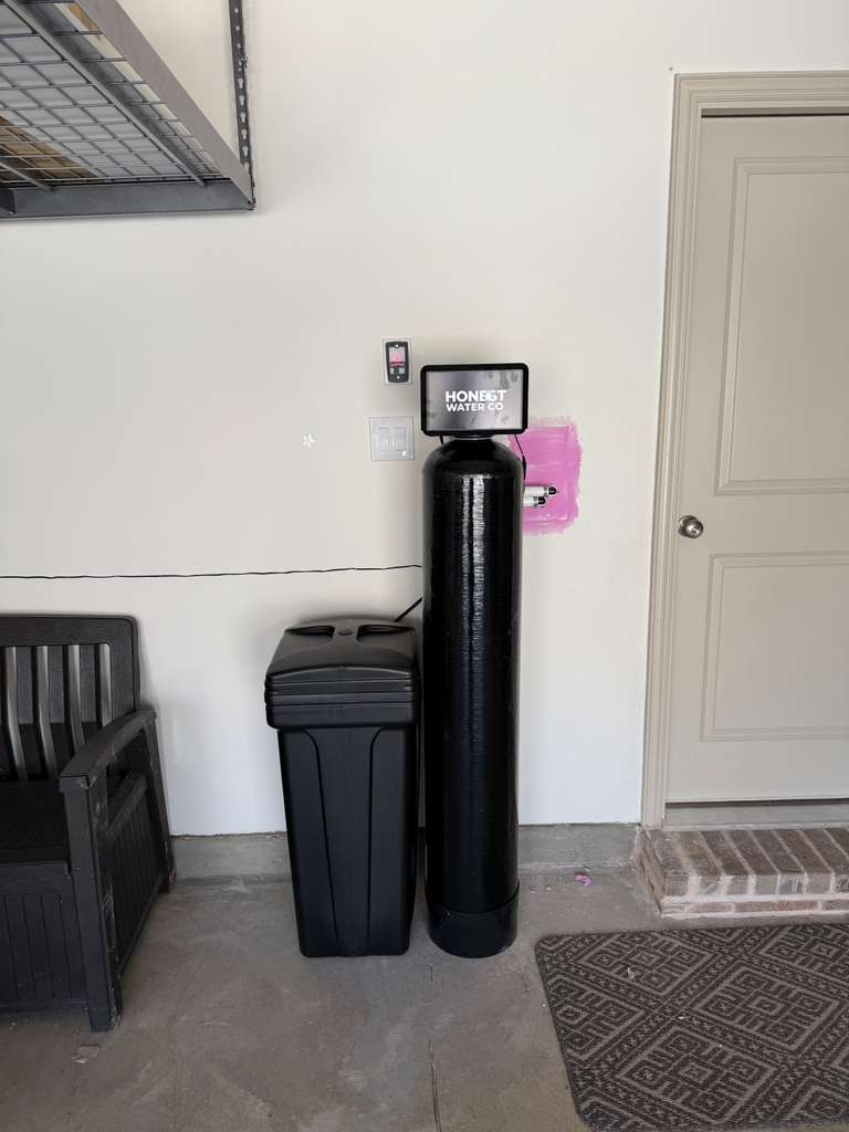 Compact single tank softener installation in a garage