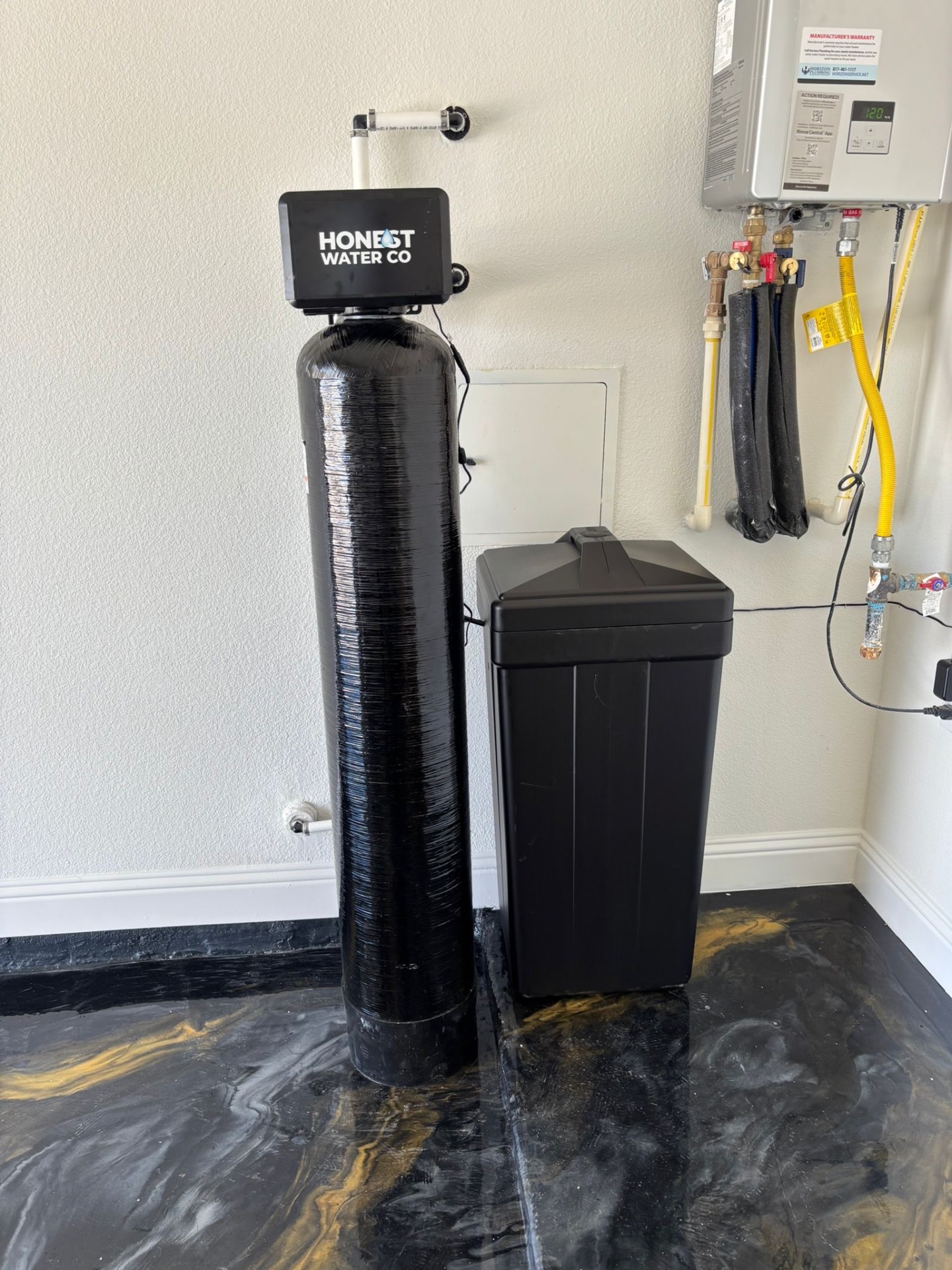 Whole-home softener installed next to a tankless water heater
