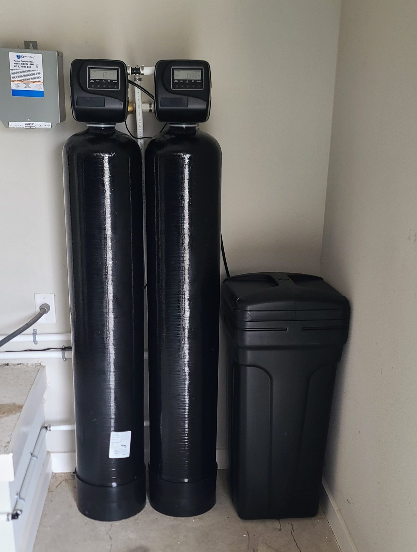 Twin tank water treatment system with digital control valves
