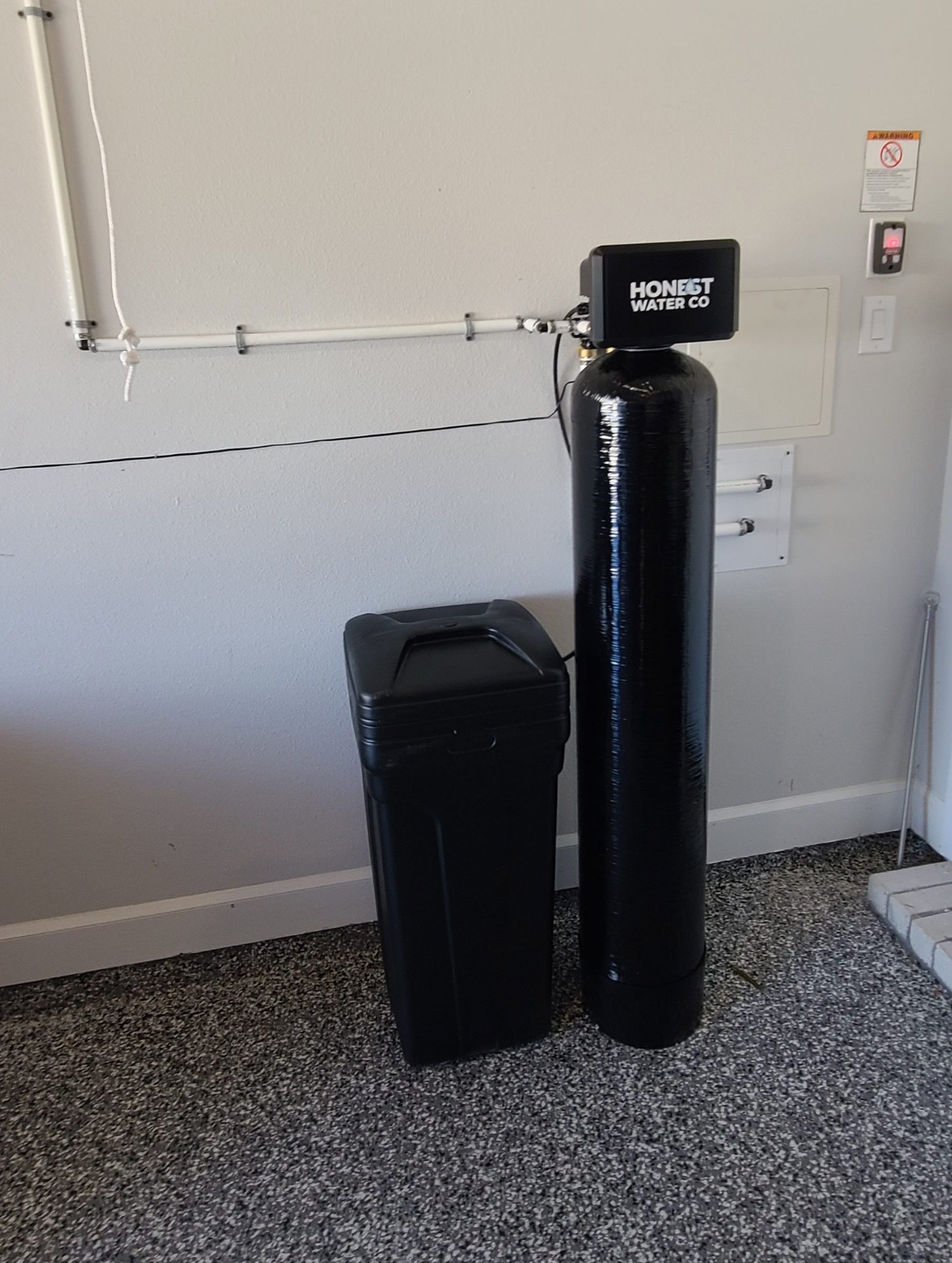 Single tank whole-home softener with brine tank in a finished garage
