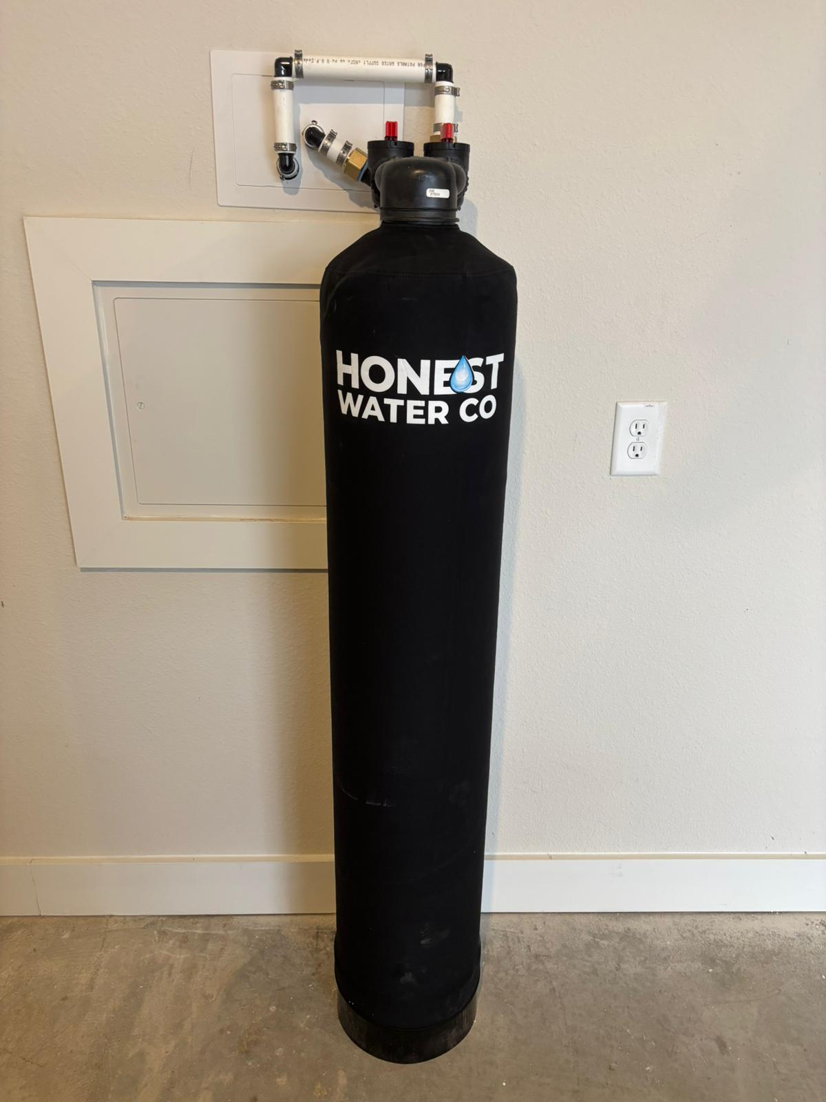 Tankless reverse osmosis drinking water system installed under a kitchen sink